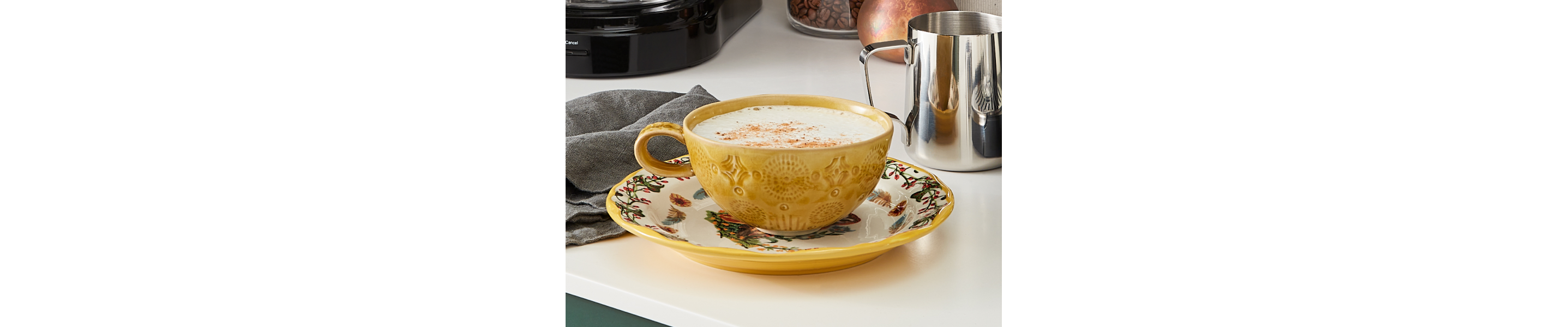 Homemade latte in a yellow coffee cup
