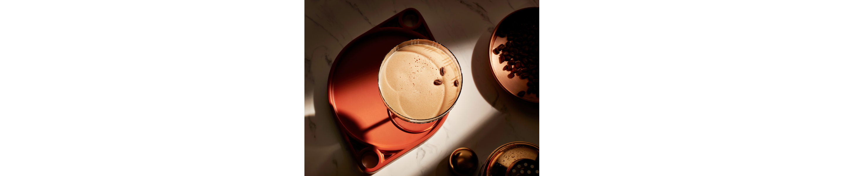 Espresso martini garnished with three coffee beans