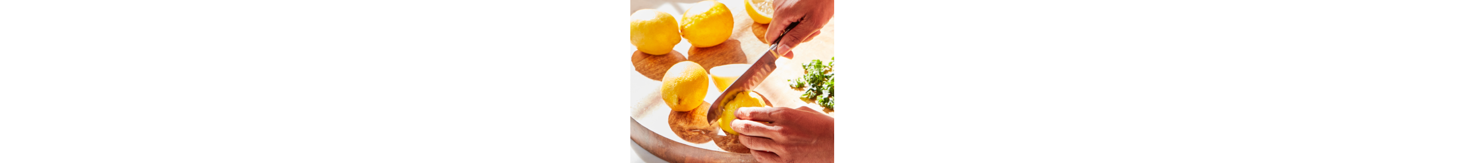A person peeling lemons.