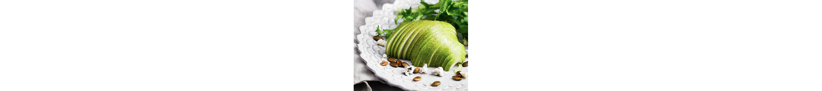 A platter of spiralized fruit and leafy greens.
