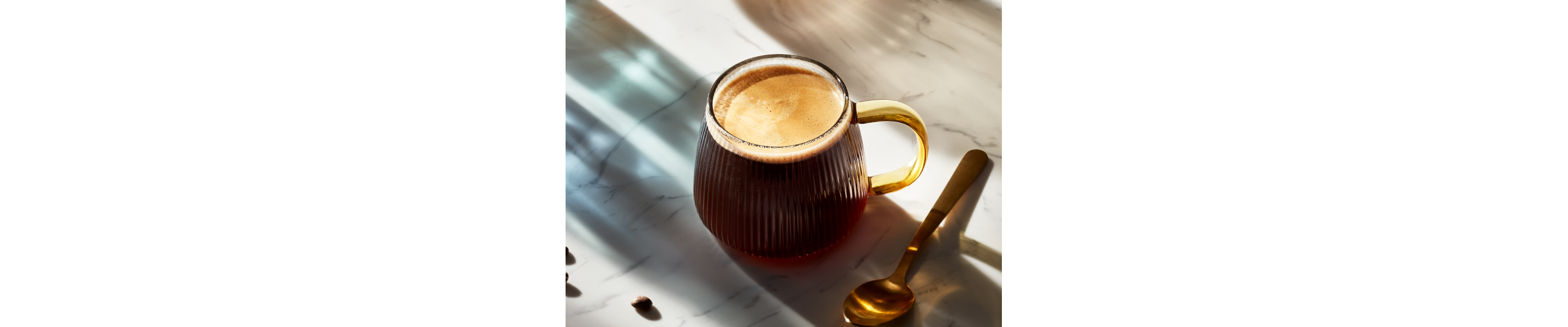 Americano in coffee cup on granite countertop