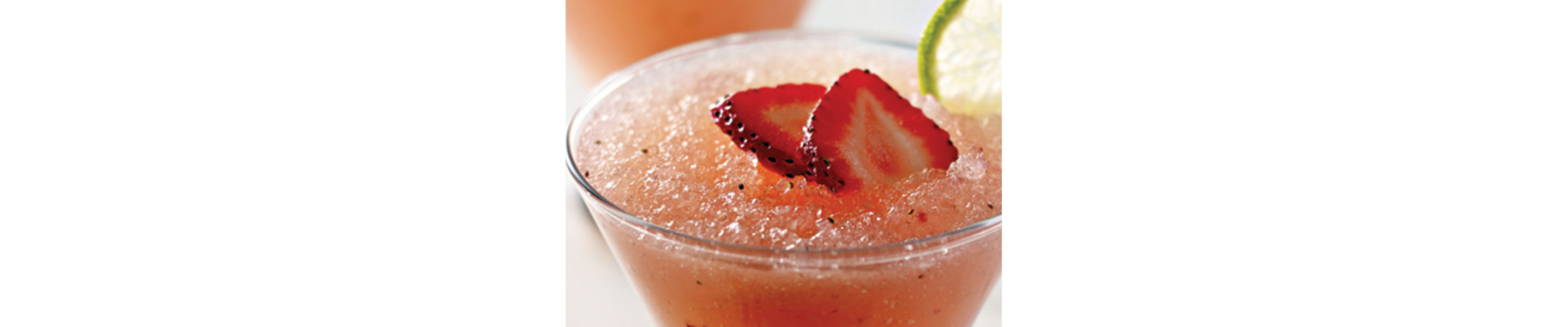 Frozen pink lemonade with strawberry garnish