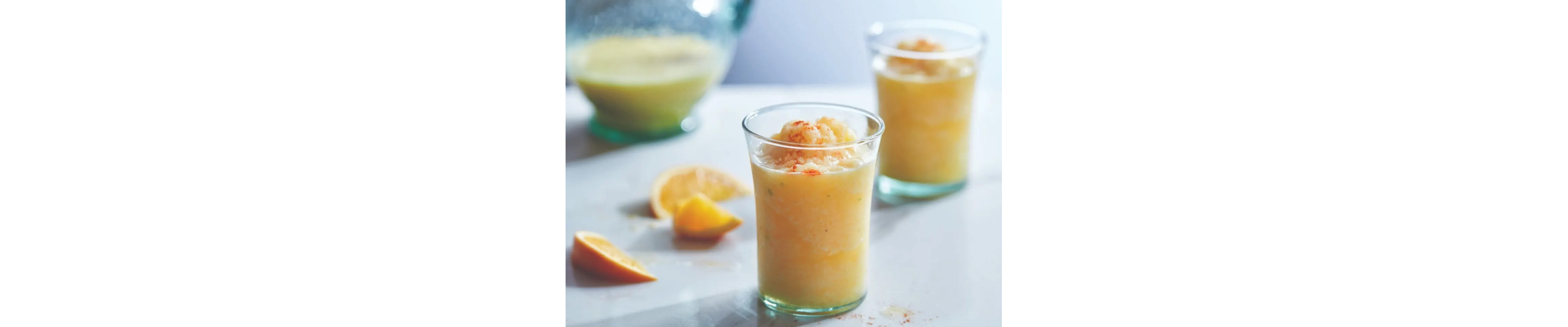 Tropical fruit slushies in clear glasses