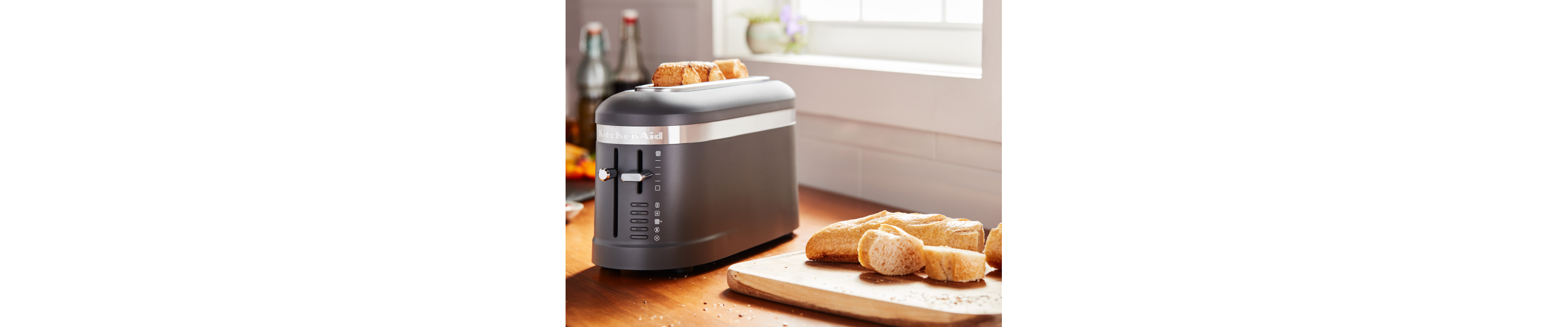 Bread being toasted in a KitchenAid® toaster.