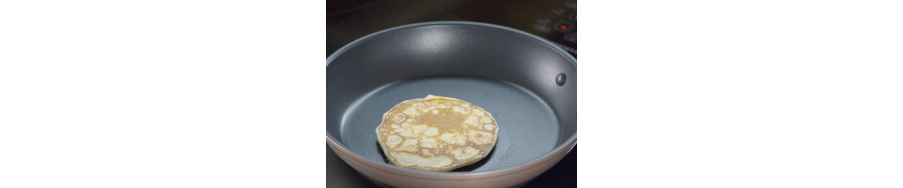 Cooking pancake inside of a skillet 