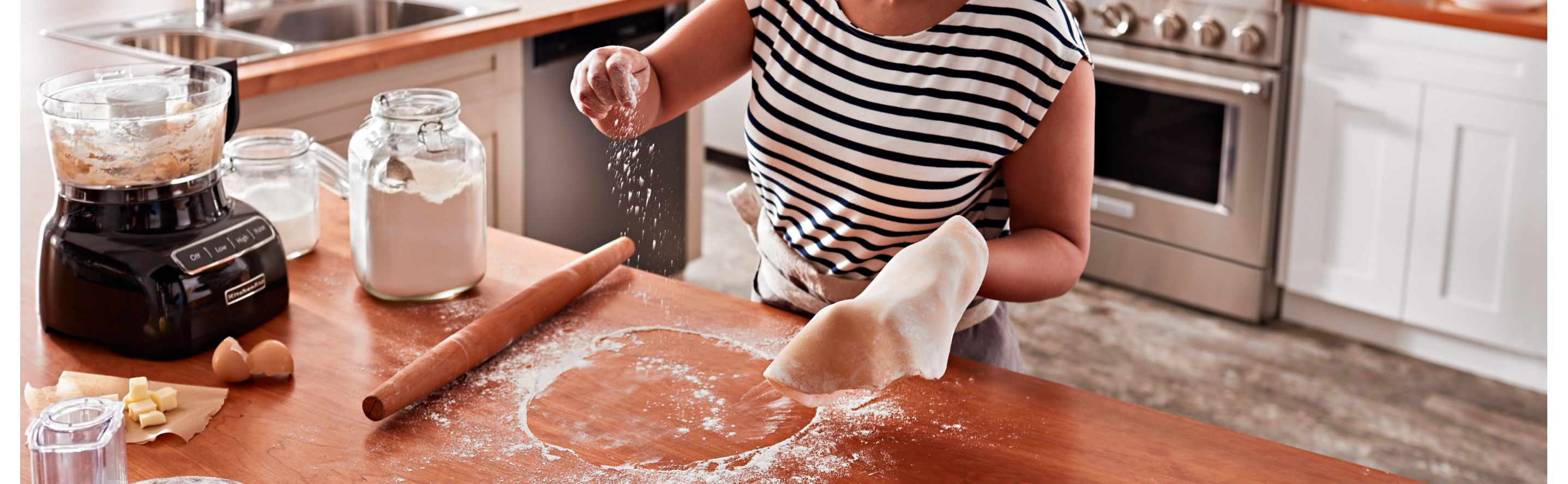 A woman preparing dough