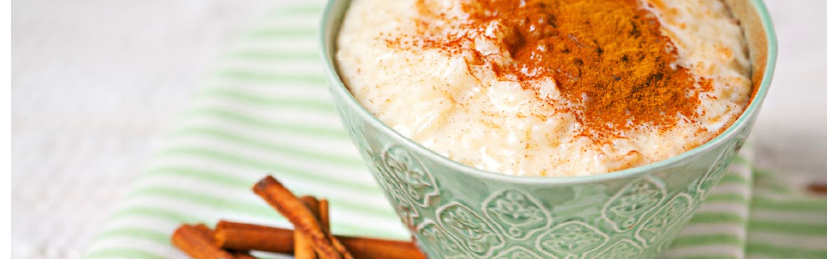 A bowl of rice pudding topped with cinnamon