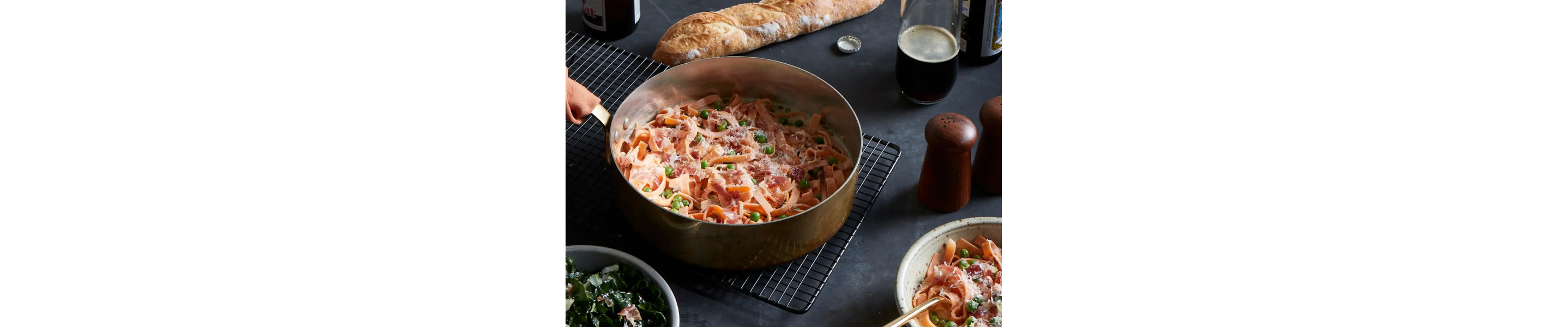 Bowl of pasta with red sauce and peas