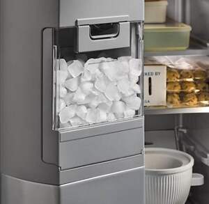 An ice maker in a refrigerator door