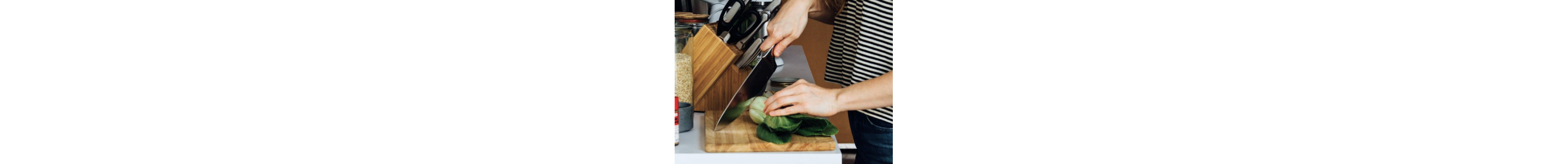 Person cutting vegetable