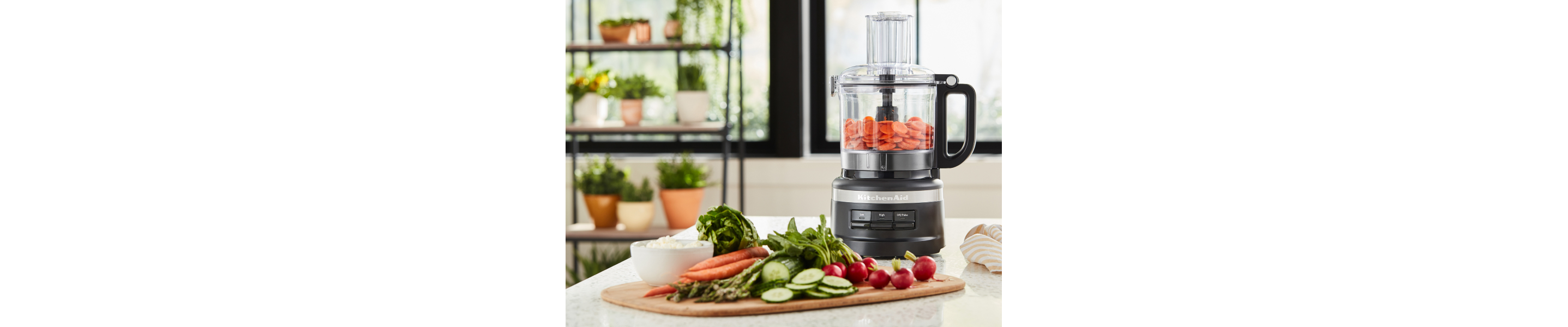 KitchenAid® food processor with chopped carrots