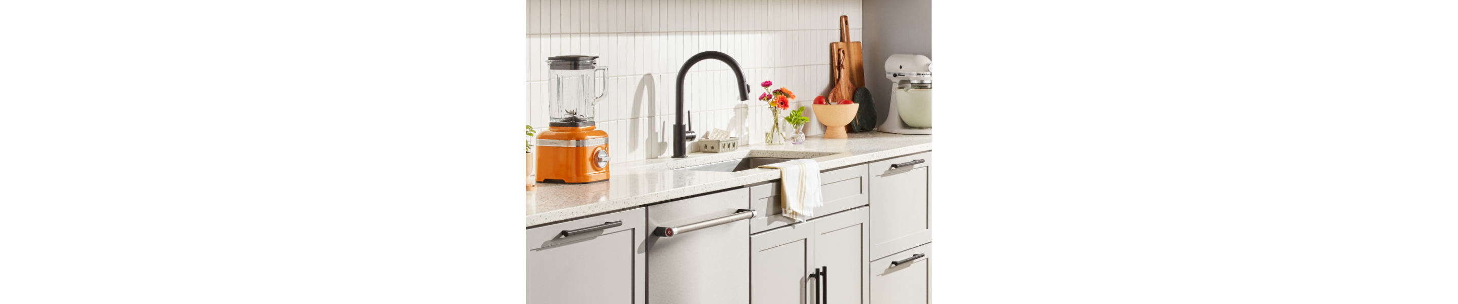 Kitchenaid® blender next to a sink