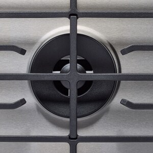A close-up of a gas burner grate