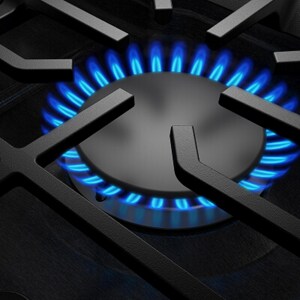 A close-up of a lit gas burner