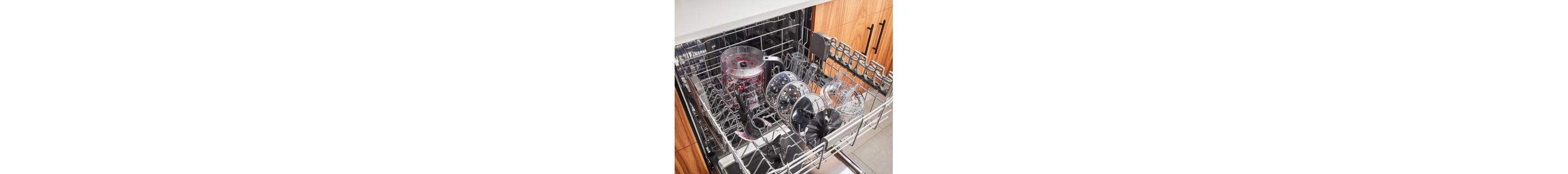 Dirty food chopper parts in top dishwasher rack