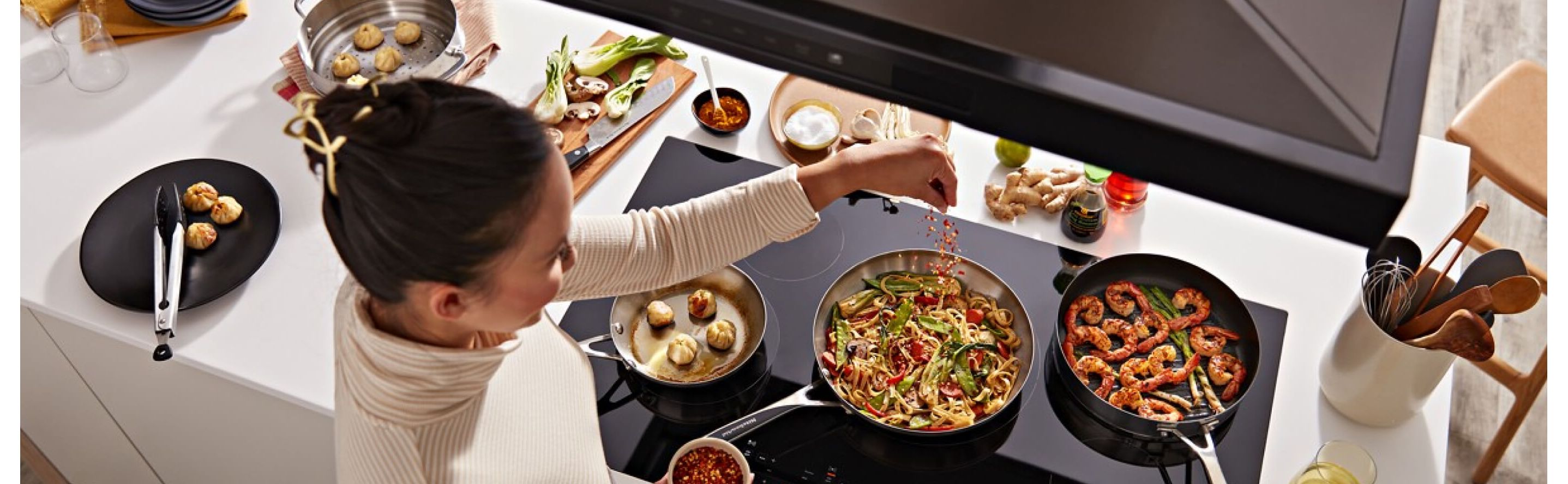 Person cooking on an electric cooktop