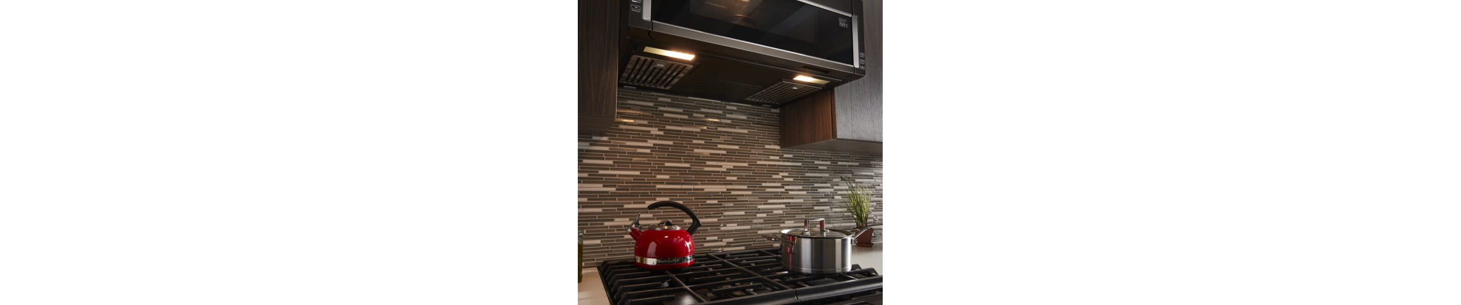 The underside of a low profile microwave with soft lighting