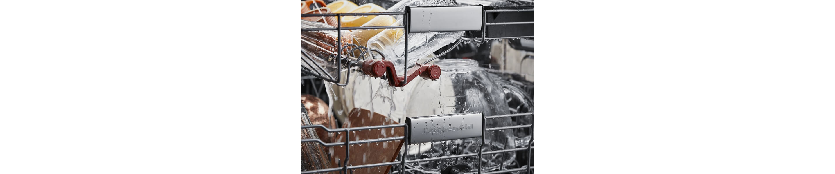 KitchenAid® wash jets washing cups and bowls in a third rack