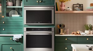 Stainless steel built-in KitchenAid® Wall Oven and Microwave in bold green cabinets