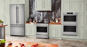 KitchenAid® Stainless Steel Appliance Suite in light mint green cabinetry