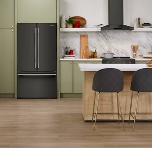 Modern kitchen with Black Ore KitchenAid® French Door Refrigerator in green cabinetry