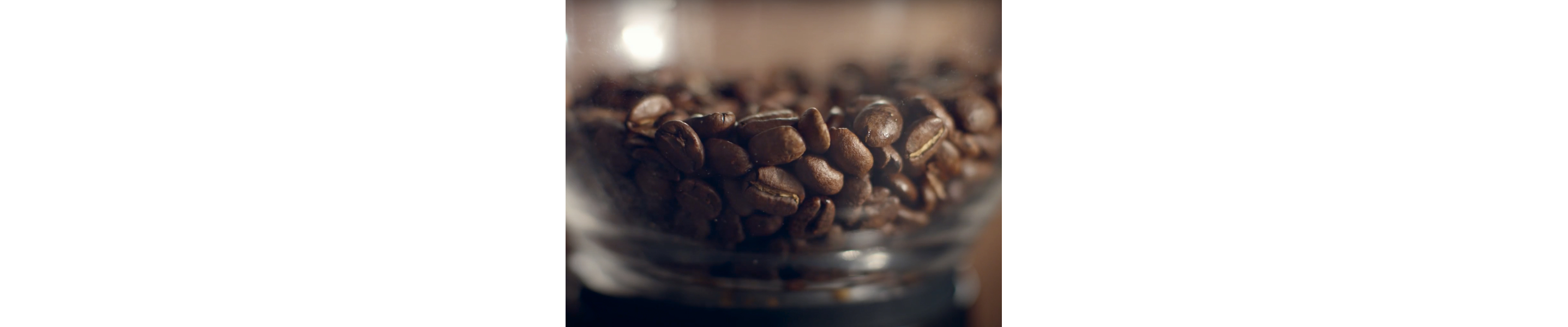 Close-up of coffee beans in glass jar