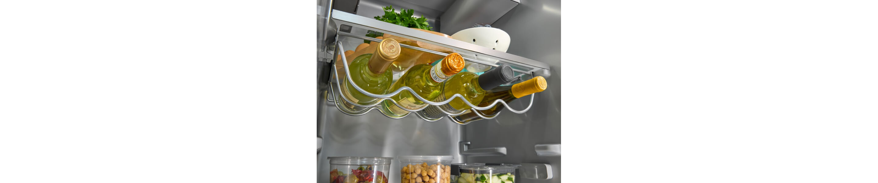 Close-up of a full wine storage rack inside a KitchenAid® refrigerator