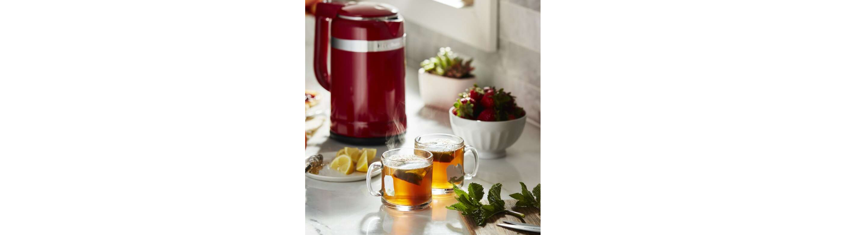 Two glass mugs of tea