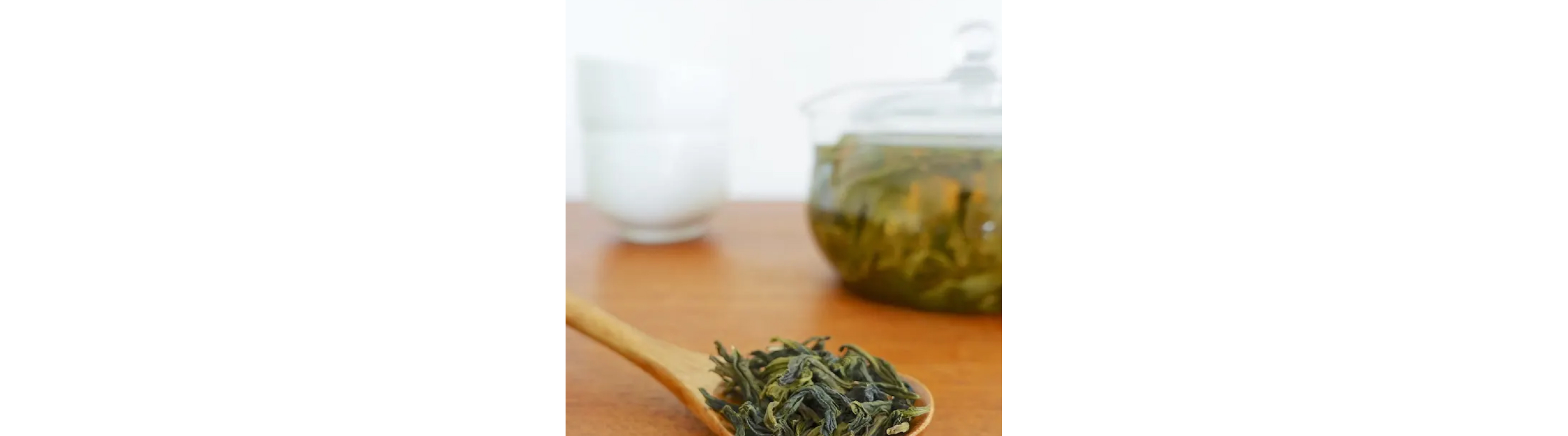 Wooden spoon full of loose leaf tea