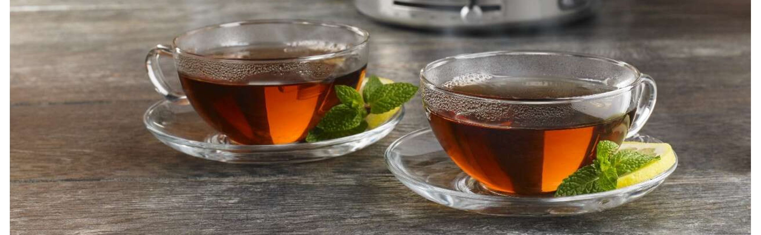 Two glass cups of tea with fresh mint