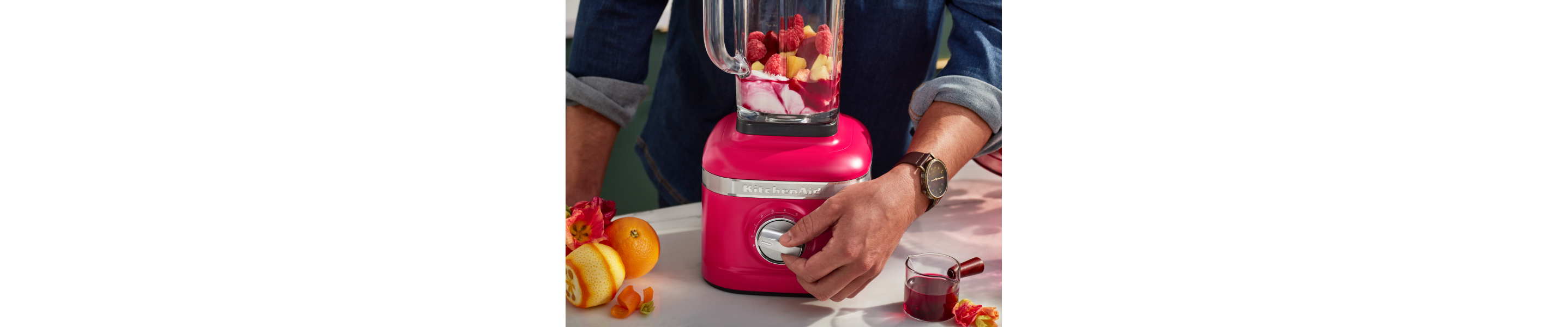 Hand adjusting speed on KitchenAid® blender