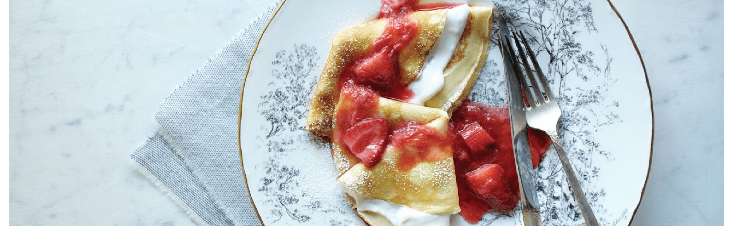 Strawberry crepes on a plate