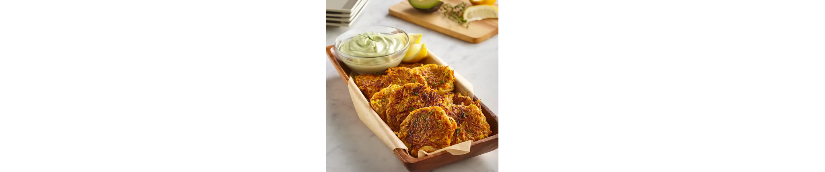 Vegetable fritters with creamy green avocado dip.