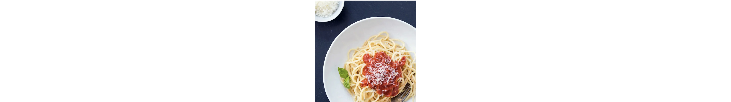 A plate of spaghetti and pasta sauce