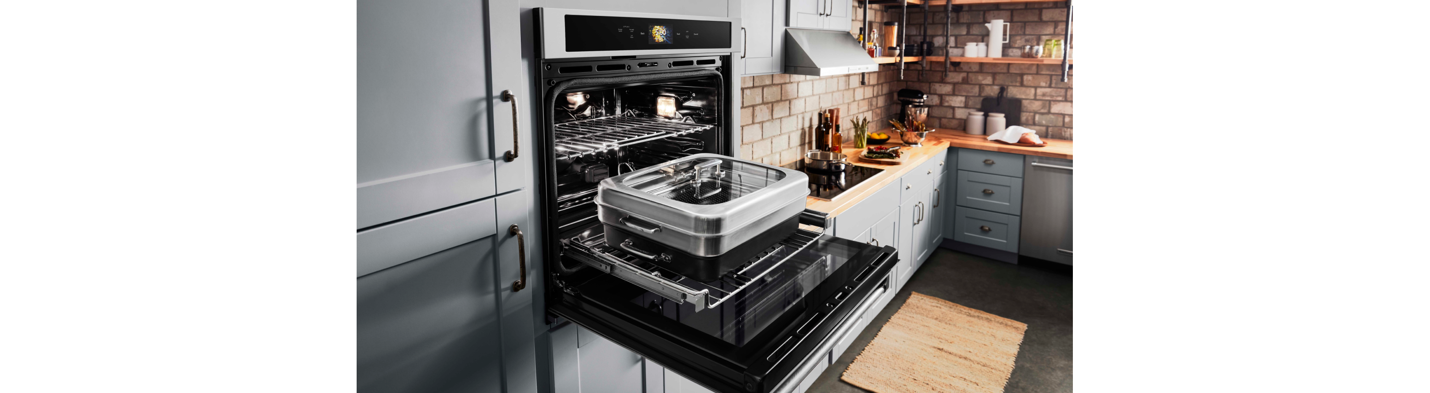 An open smart wall oven with attachment