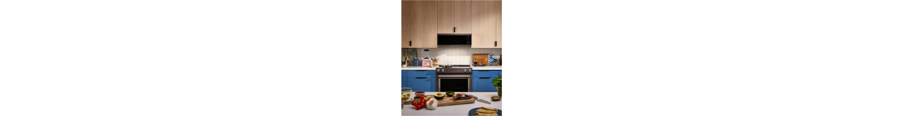 A modern kitchen with blue and brown cabinetry