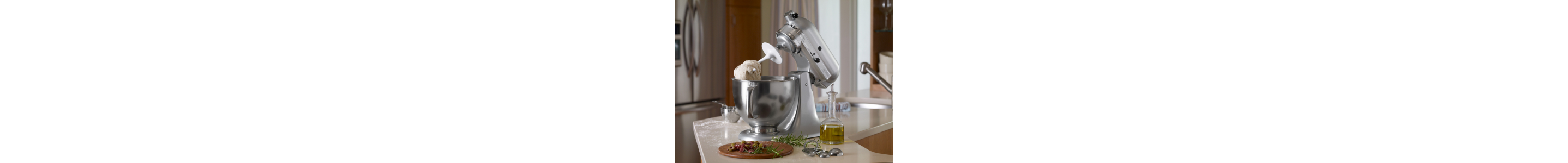 Silver KitchenAid® stand mixer with the dough hook accessory