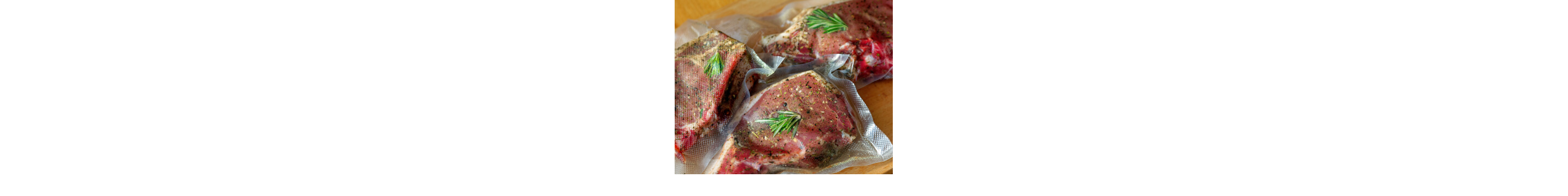 Three pieces of meat seasoned with rosemary in sous vide bags