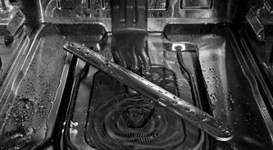 The bottom of a dishwasher that is draining