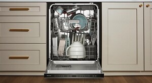A closeup of a dishwasher loaded with clean dishes