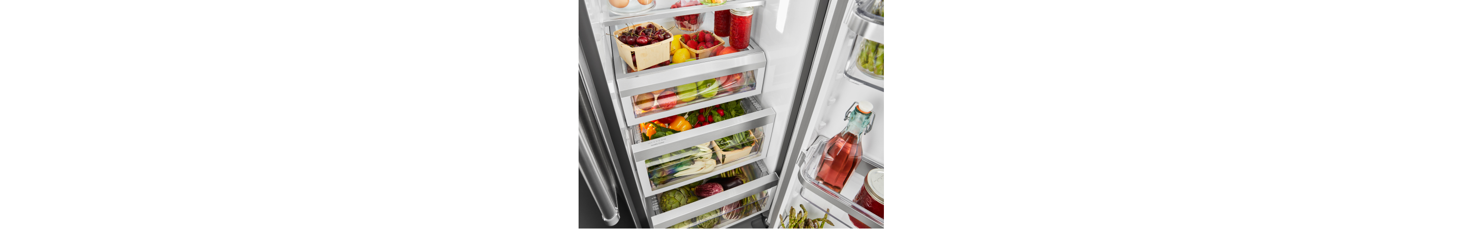 Open refrigerator door filled with food