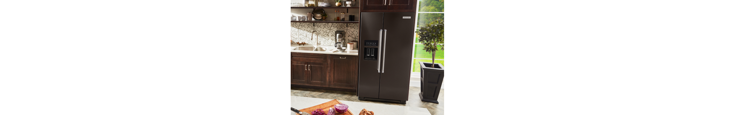 KitchenAid® side-by-side refrigerator in brown cabinetry