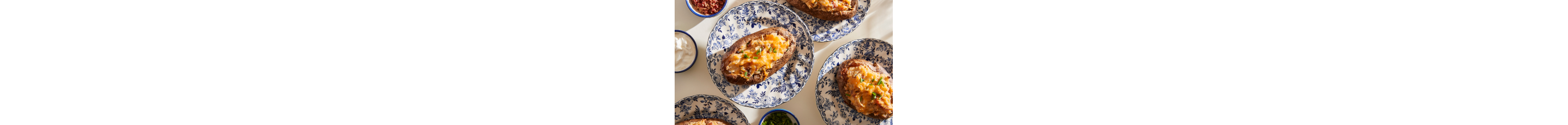 Twice Baked Potatoes on blue patterned plates.