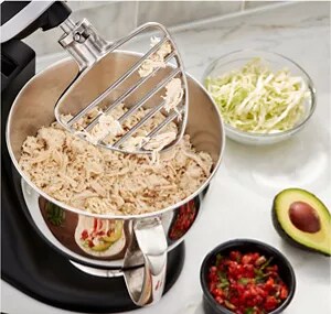 A pastry beater attachment on a stand mixer.