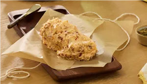 Freshly made compound butter on parchment paper.