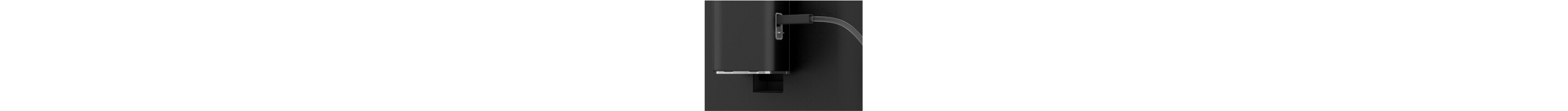 A milk tube going into an espresso machine