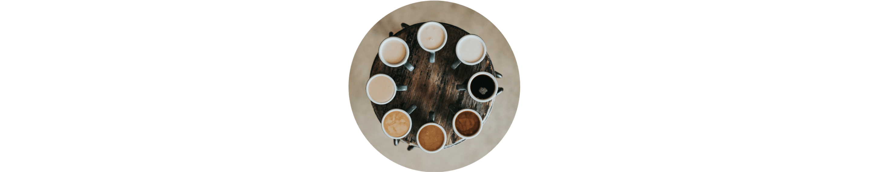 Cups of coffee arranged in a circle from light to dark 