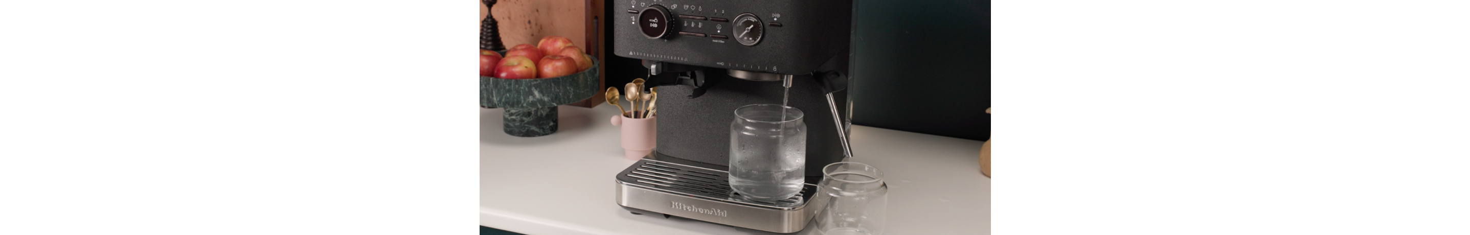 Hot water running through an espresso machine steam wand