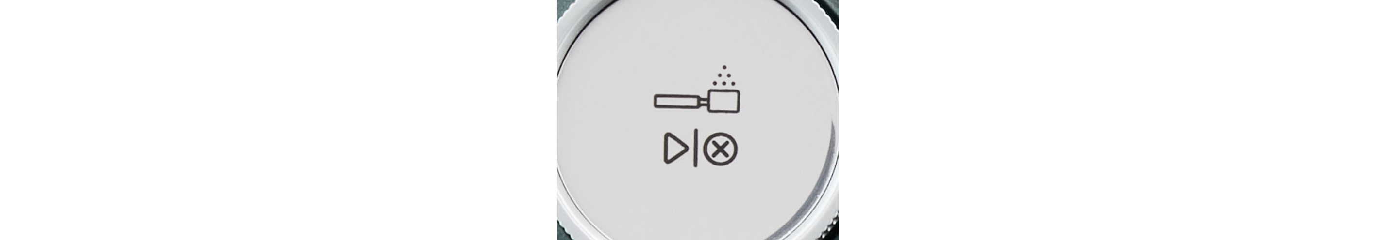 An espresso machine start/stop button