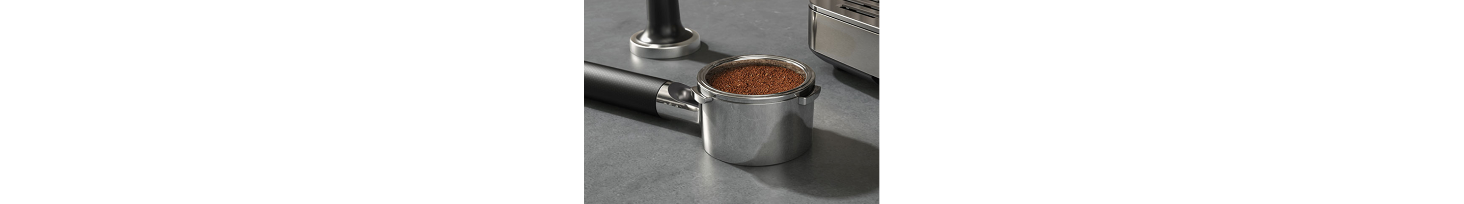 A portafilter filled with ground espresso